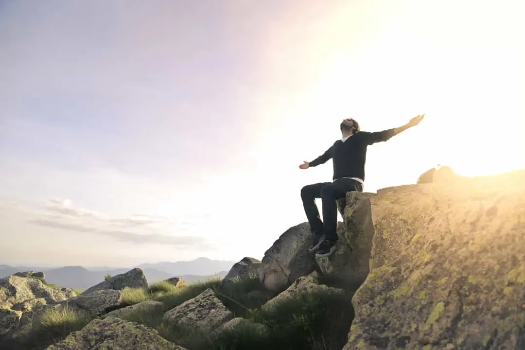 A free person with arms open to the sky